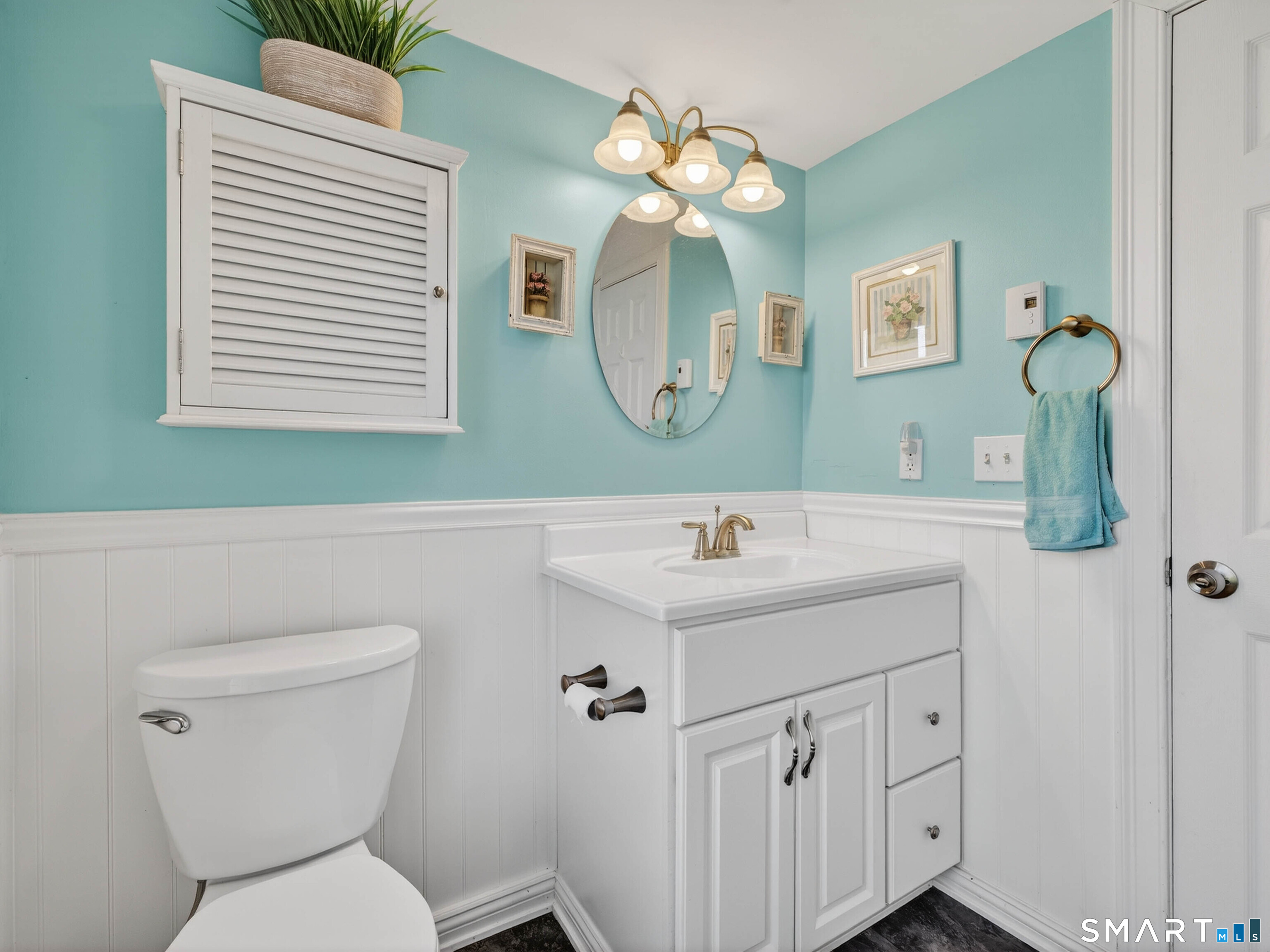 82 Sunset Street, Unit 68 Waterford, CT 06385 - Photo 12 of 20 a bathroom with a toilet sink and mirror