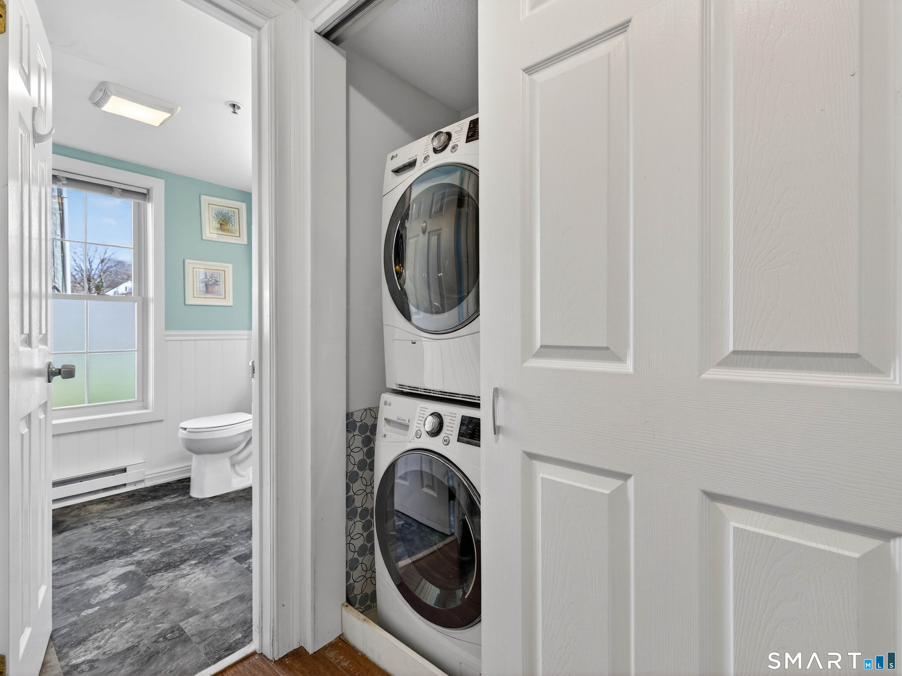 82 Sunset Street, Unit 68 Waterford, CT 06385 - Photo 13 of 20 a view of a hallway with washer and dryer