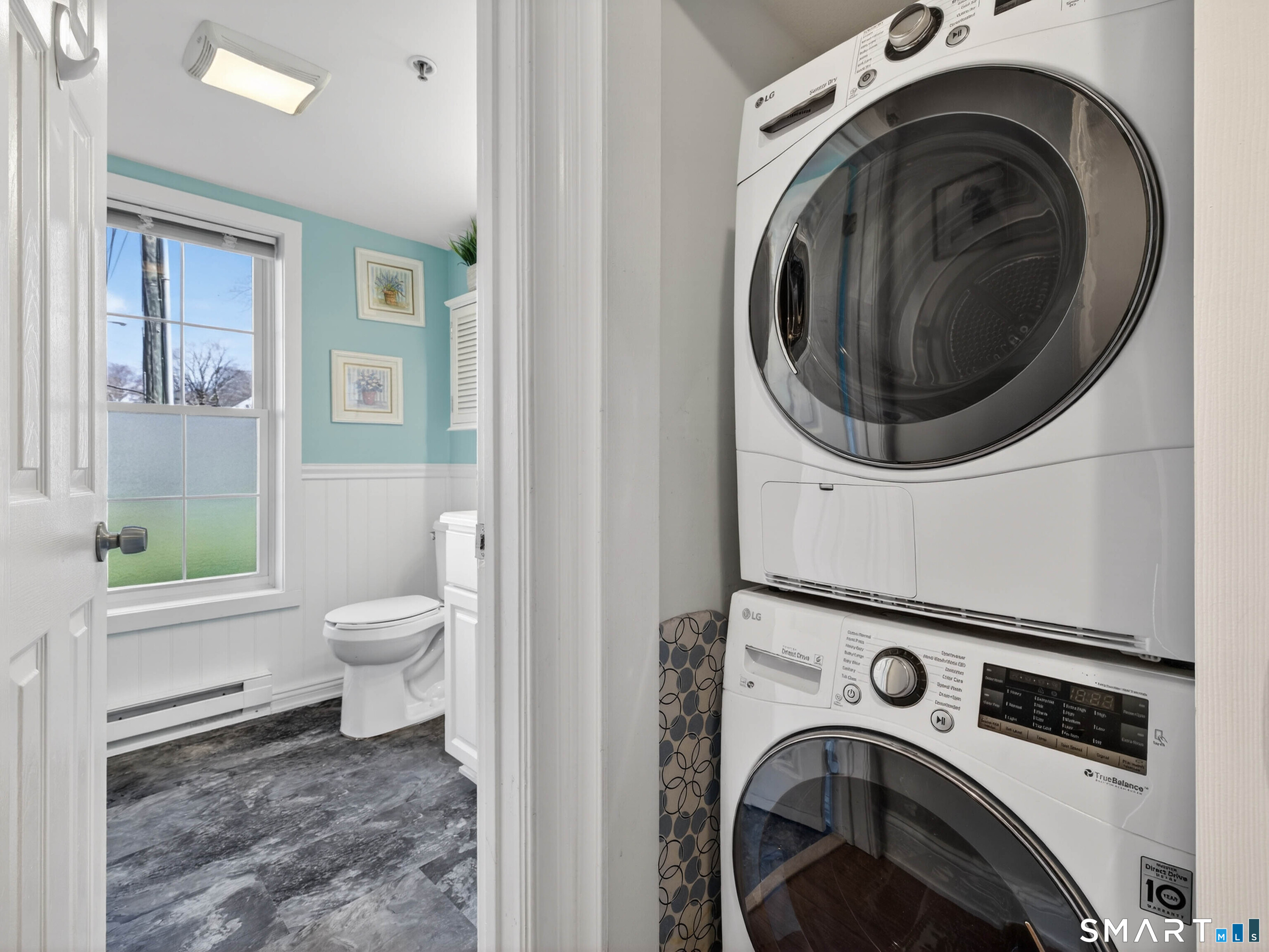 82 Sunset Street, Unit 68 Waterford, CT 06385 - Photo 14 of 20 a view of a hallway with washer and dryer