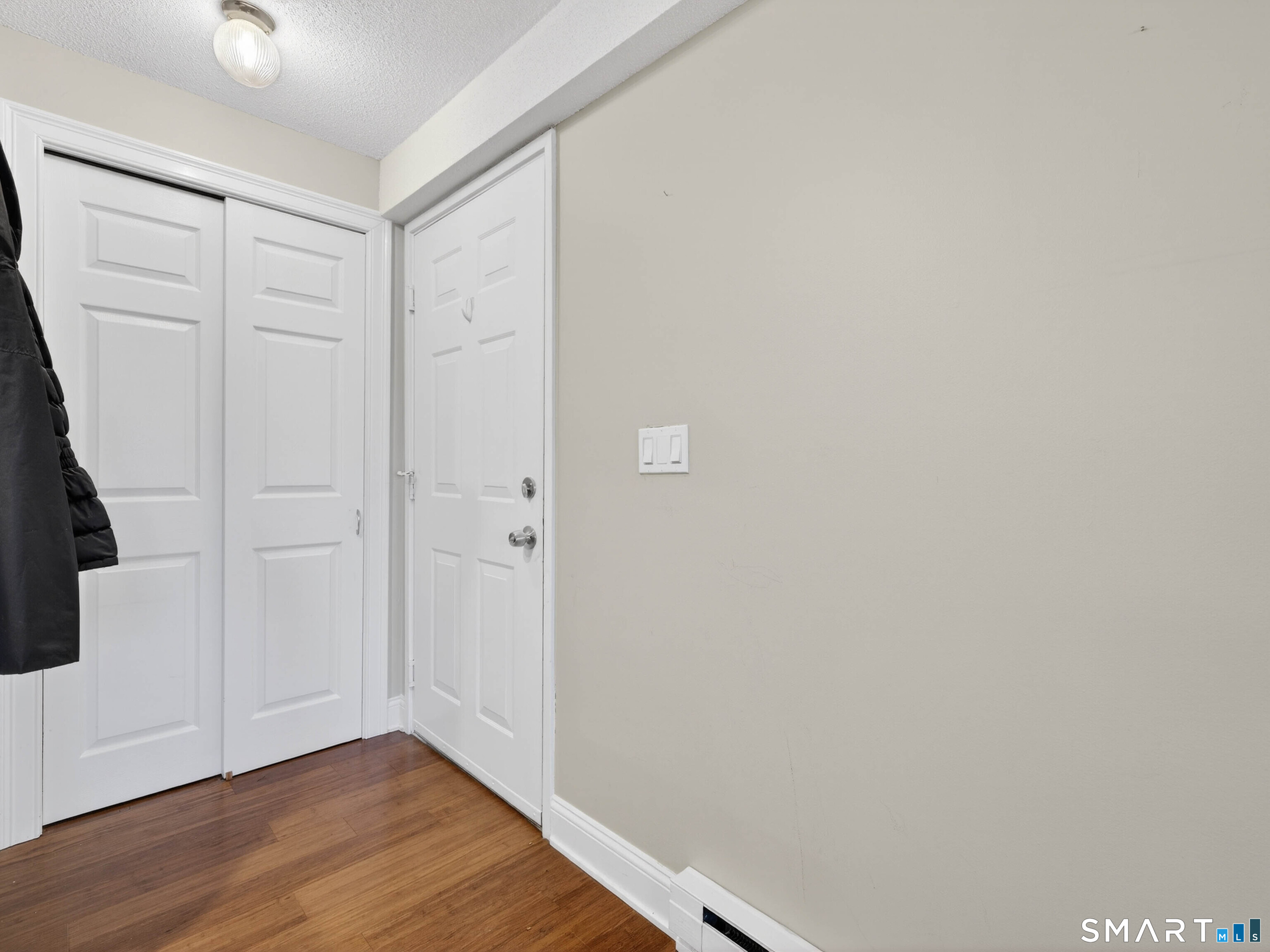82 Sunset Street, Unit 68 Waterford, CT 06385 - Photo 15 of 20 a view of an empty room with wooden floor