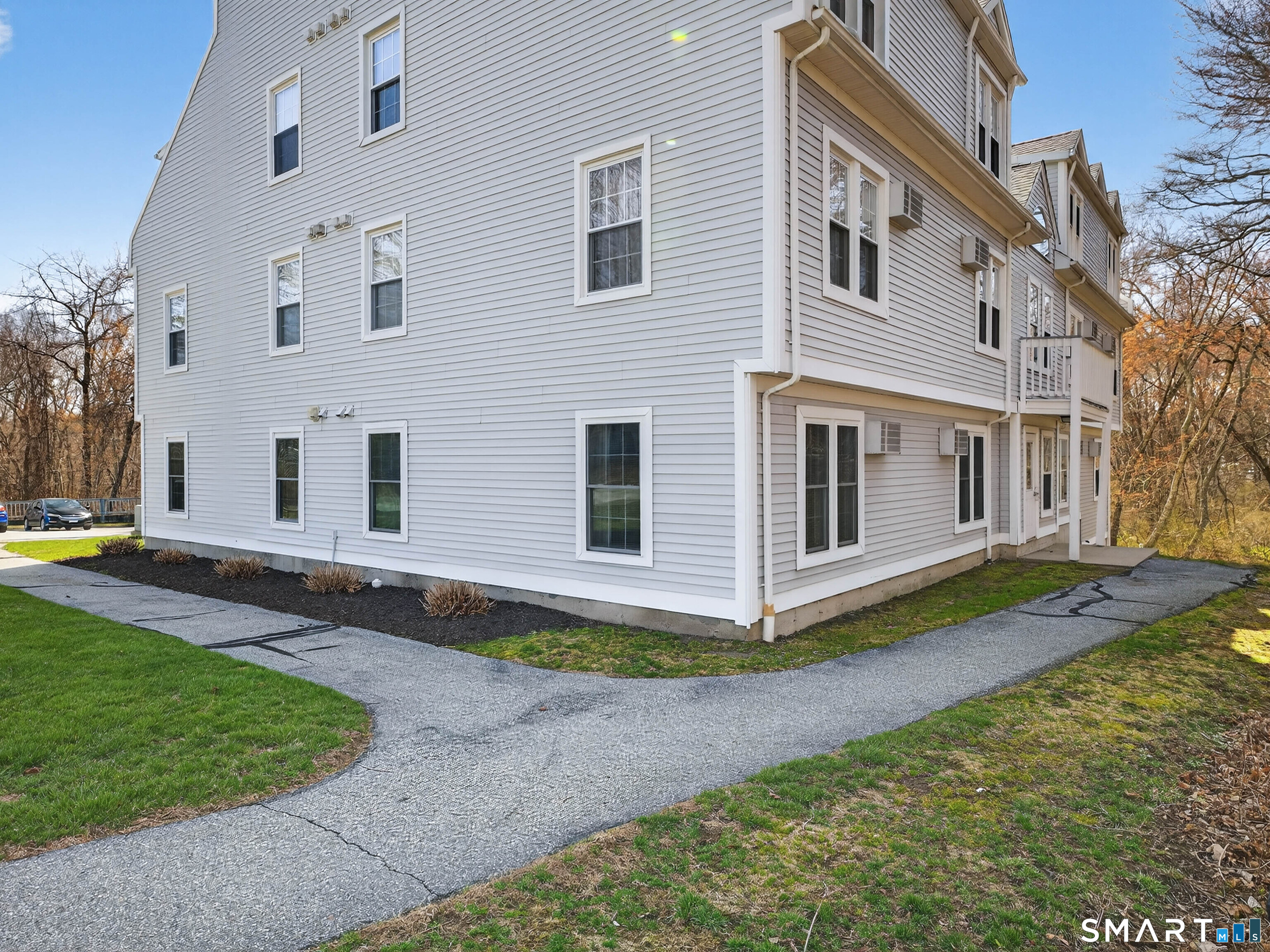 82 Sunset Street, Unit 68 Waterford, CT 06385 - Photo 20 of 20 a view of a house with backyard and sitting area