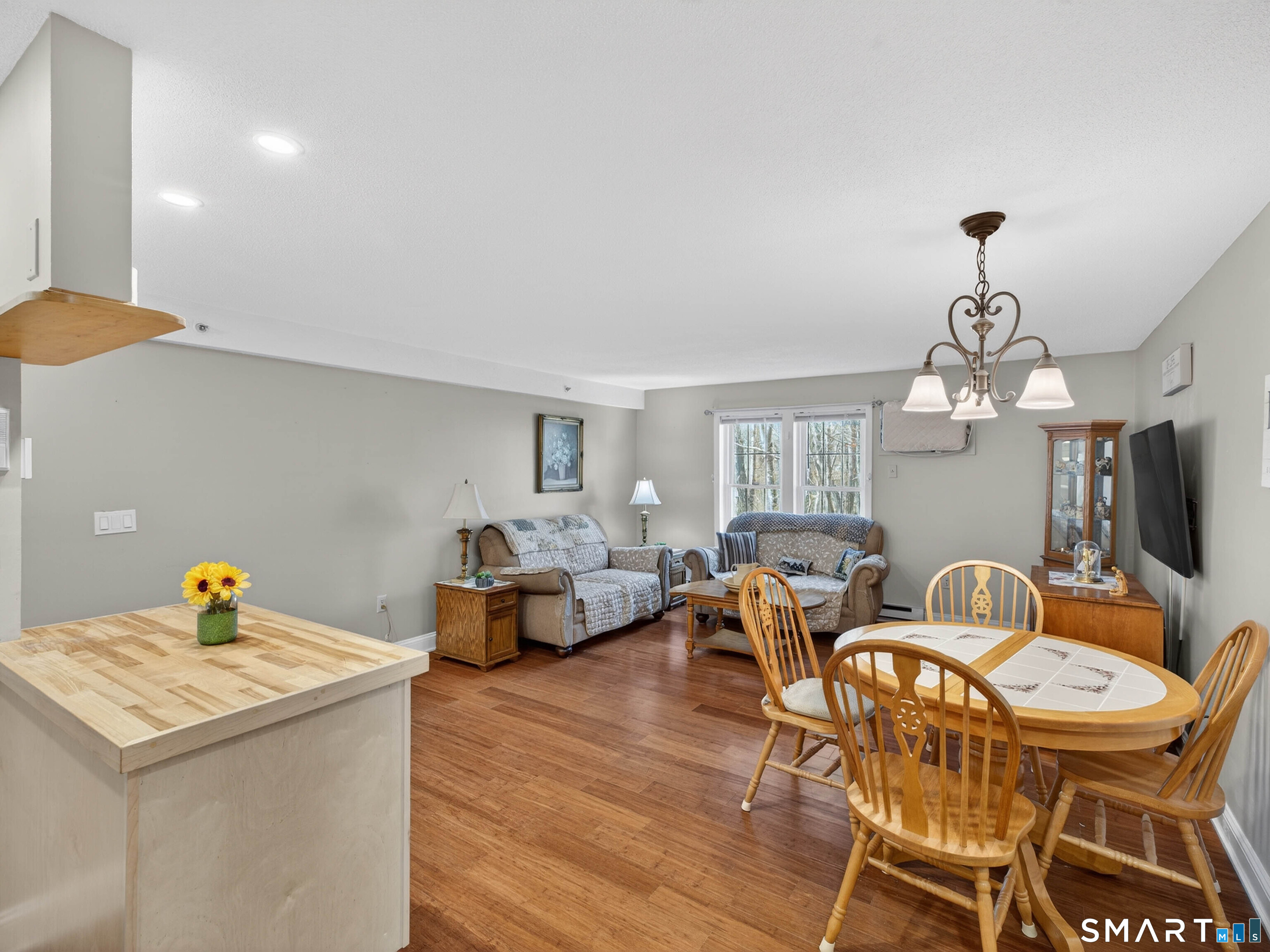82 Sunset Street, Unit 68 Waterford, CT 06385 - Photo 3 of 20 a living room with furniture and a chandelier