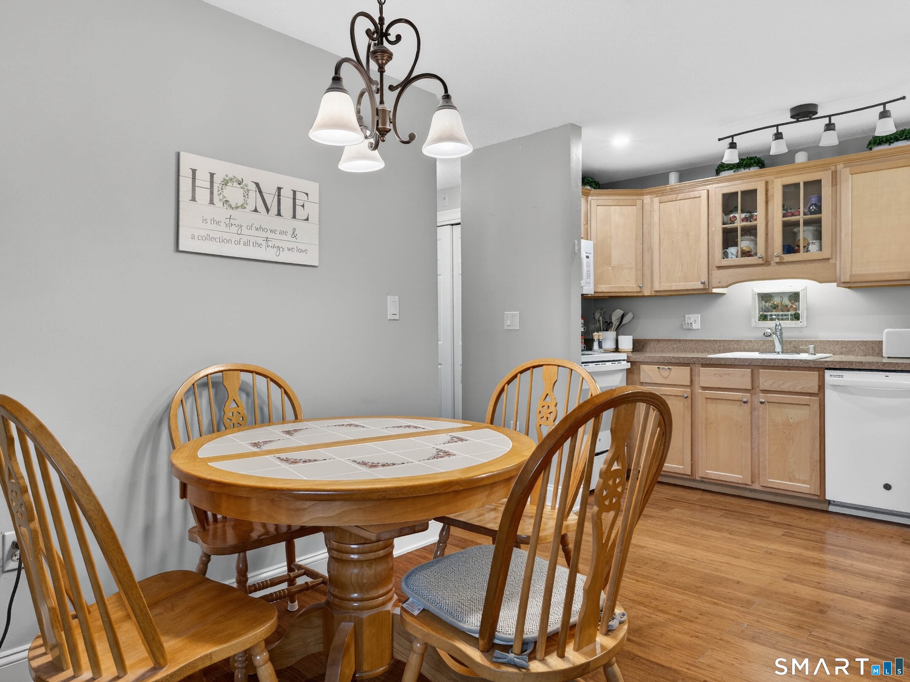 82 Sunset Street, Unit 68 Waterford, CT 06385 - Photo 8 of 20 a view of a dining room with furniture and wooden floor