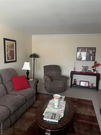 a living room with furniture and a couches