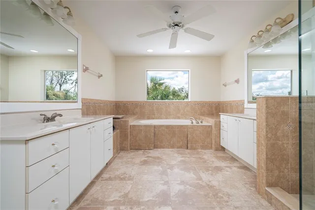 a view of a balcony with wooden floor and fence