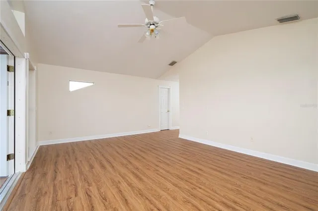 a view of a swimming pool with a yard