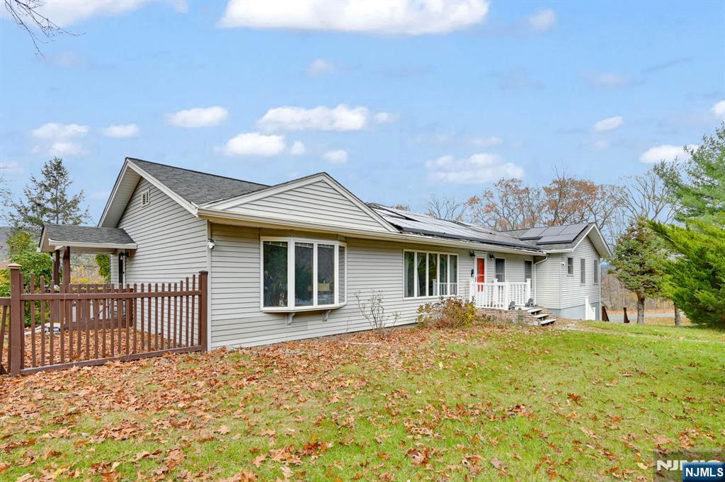 699 Shore Road West Milford, NJ 07421 - Photo 2 of 50 a front view of a house with a yard