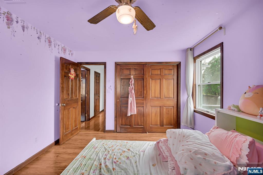 699 Shore Road West Milford, NJ 07421 - Photo 33 of 50 a bedroom with a bed and a chandelier
