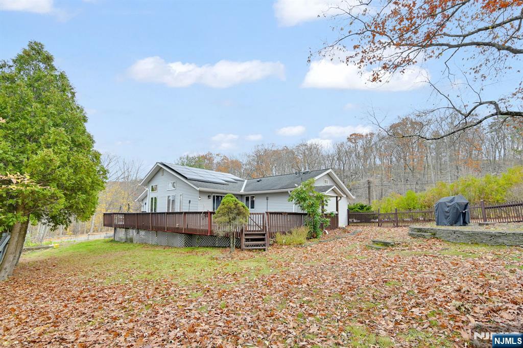 699 Shore Road West Milford, NJ 07421 - Photo 42 of 50 a small house with a trees in the background