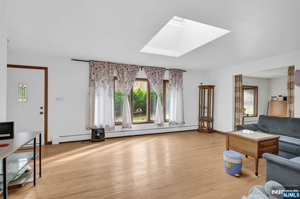 699 Shore Road West Milford, NJ 07421 - Photo 7 of 50 a view of an empty room with glass door and glass door