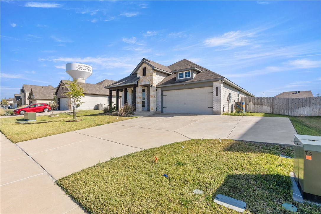 1925 Viva Road Bryan, TX 77807 - Photo 2 of 26 View of front of home featuring stone siding and driveway