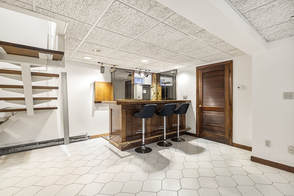 19 Johnson Avenue Winthrop, MA 02152 - Photo 13 of 42 a view of a room with shelves