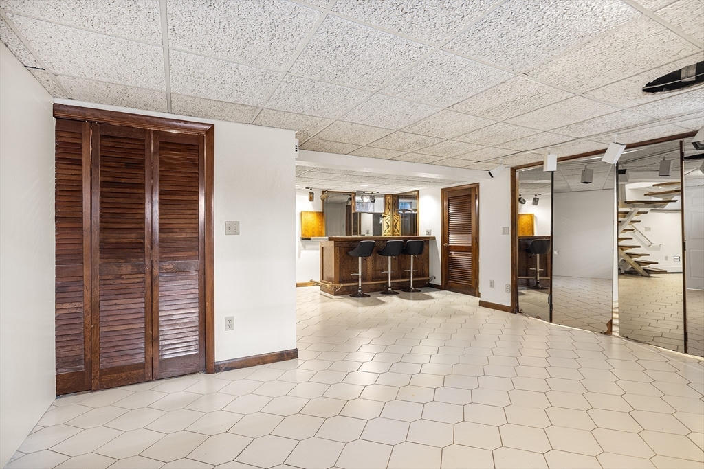 19 Johnson Avenue Winthrop, MA 02152 - Photo 15 of 42 a view of a livingroom with wooden cabinets