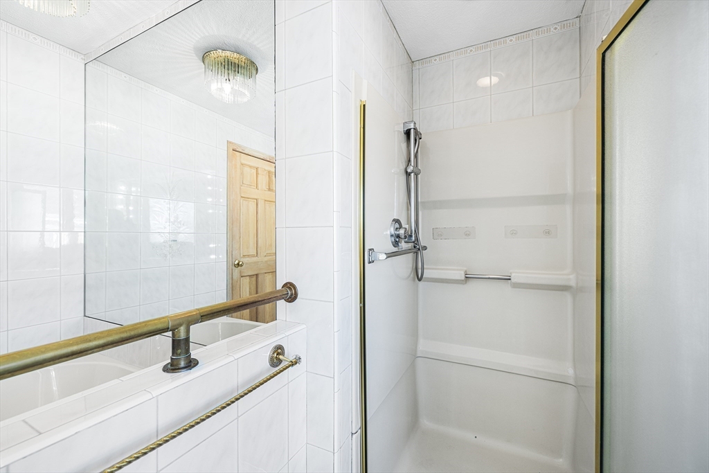 19 Johnson Avenue Winthrop, MA 02152 - Photo 25 of 42 a bathroom with a tub and a sink