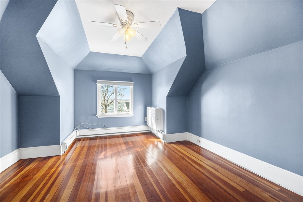 19 Johnson Avenue Winthrop, MA 02152 - Photo 34 of 42 a view of an empty room with wooden floor and a window