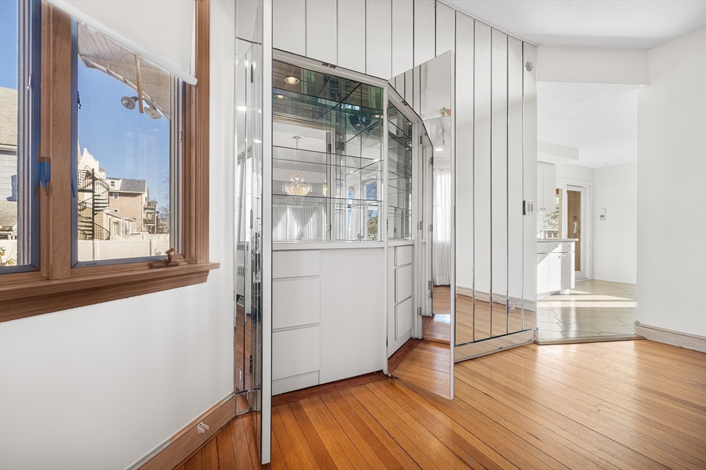 19 Johnson Avenue Winthrop, MA 02152 - Photo 7 of 42 wooden floor in an empty room with a window