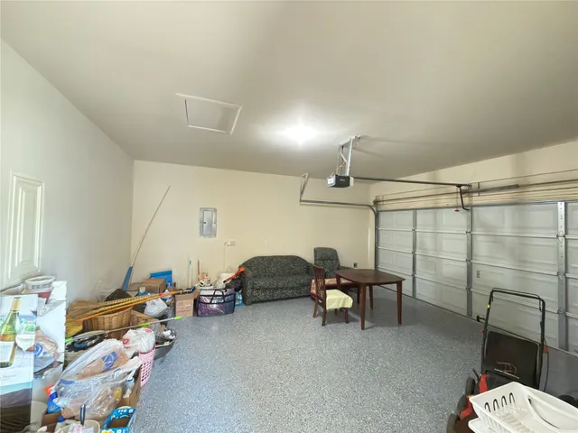 a bedroom with furniture and a chandelier