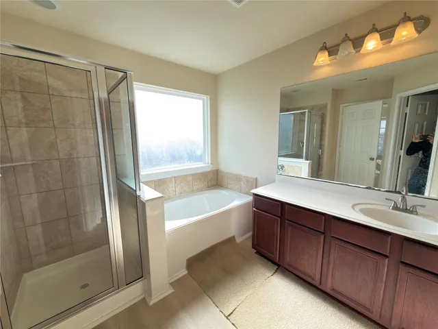 a bathroom with a bathtub and a sink