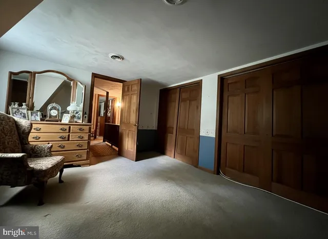 a view of a livingroom with furniture and windows