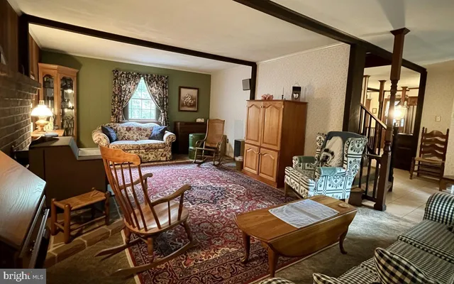 a living room with furniture and a window