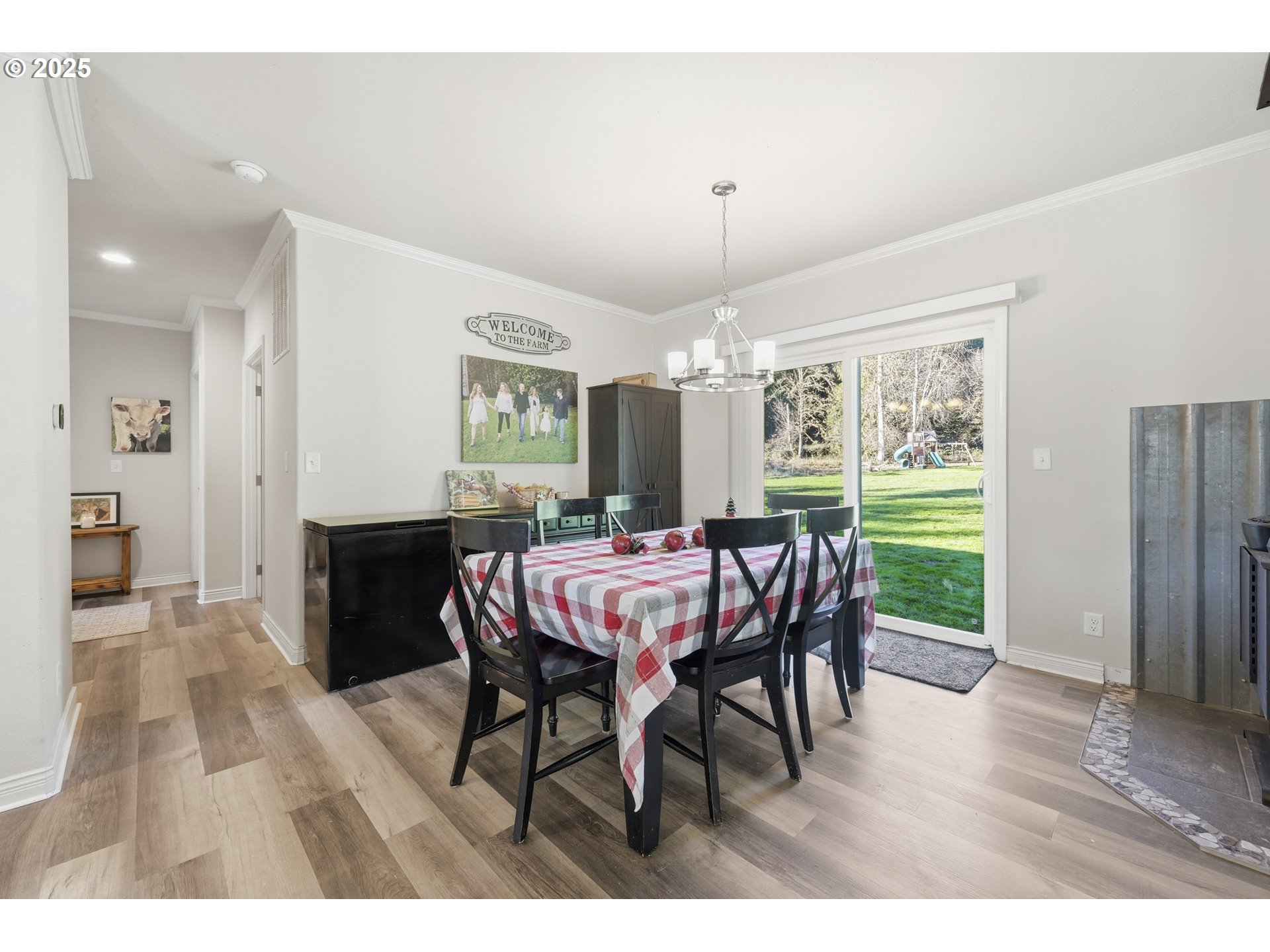 39557 Little Fall Creek Road Fall Creek, OR 97438 - Photo 11 of 43 a view of a dining room with furniture window and wooden floor