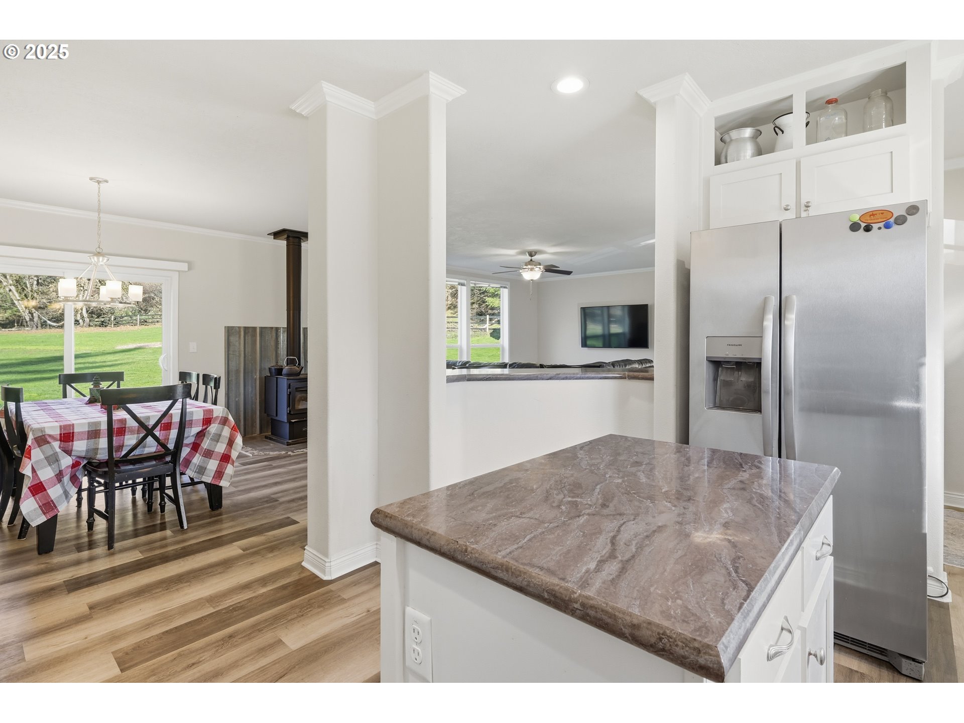 39557 Little Fall Creek Road Fall Creek, OR 97438 - Photo 15 of 43 a kitchen with stainless steel appliances kitchen island granite countertop a refrigerator a stove and a sink