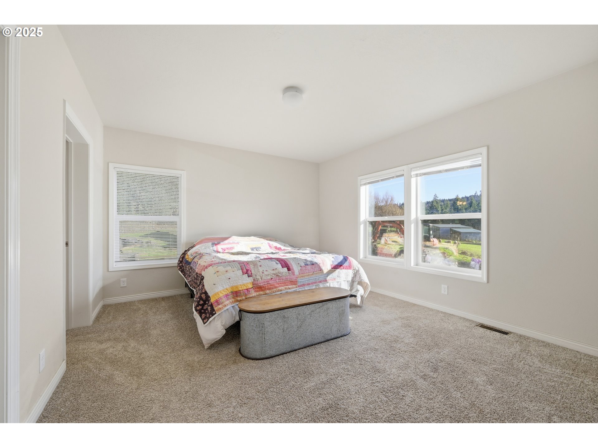 39557 Little Fall Creek Road Fall Creek, OR 97438 - Photo 19 of 43 a bedroom with a bed and a window