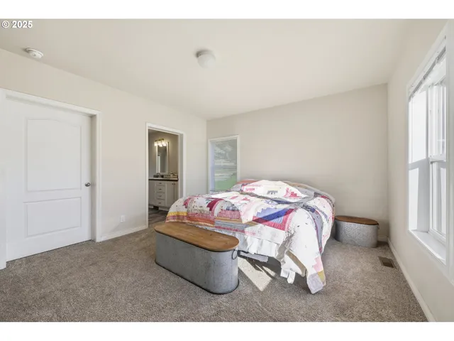 a bathroom with a double vanity sink toilet mirror and bathtub
