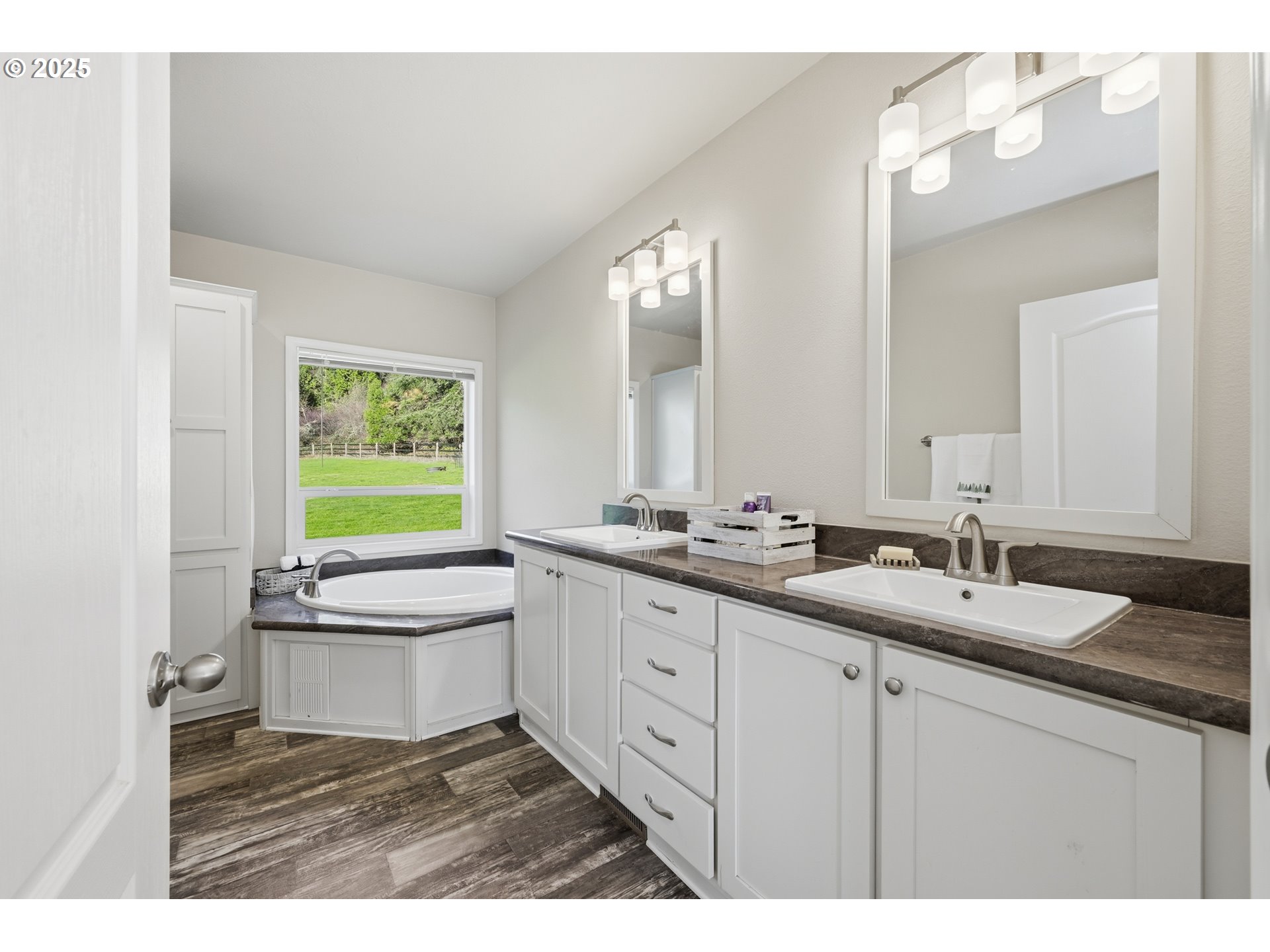 39557 Little Fall Creek Road Fall Creek, OR 97438 - Photo 21 of 43 a bathroom with a double vanity sink toilet mirror and bathtub