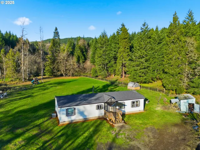 a view of a lush green hillside and mountains