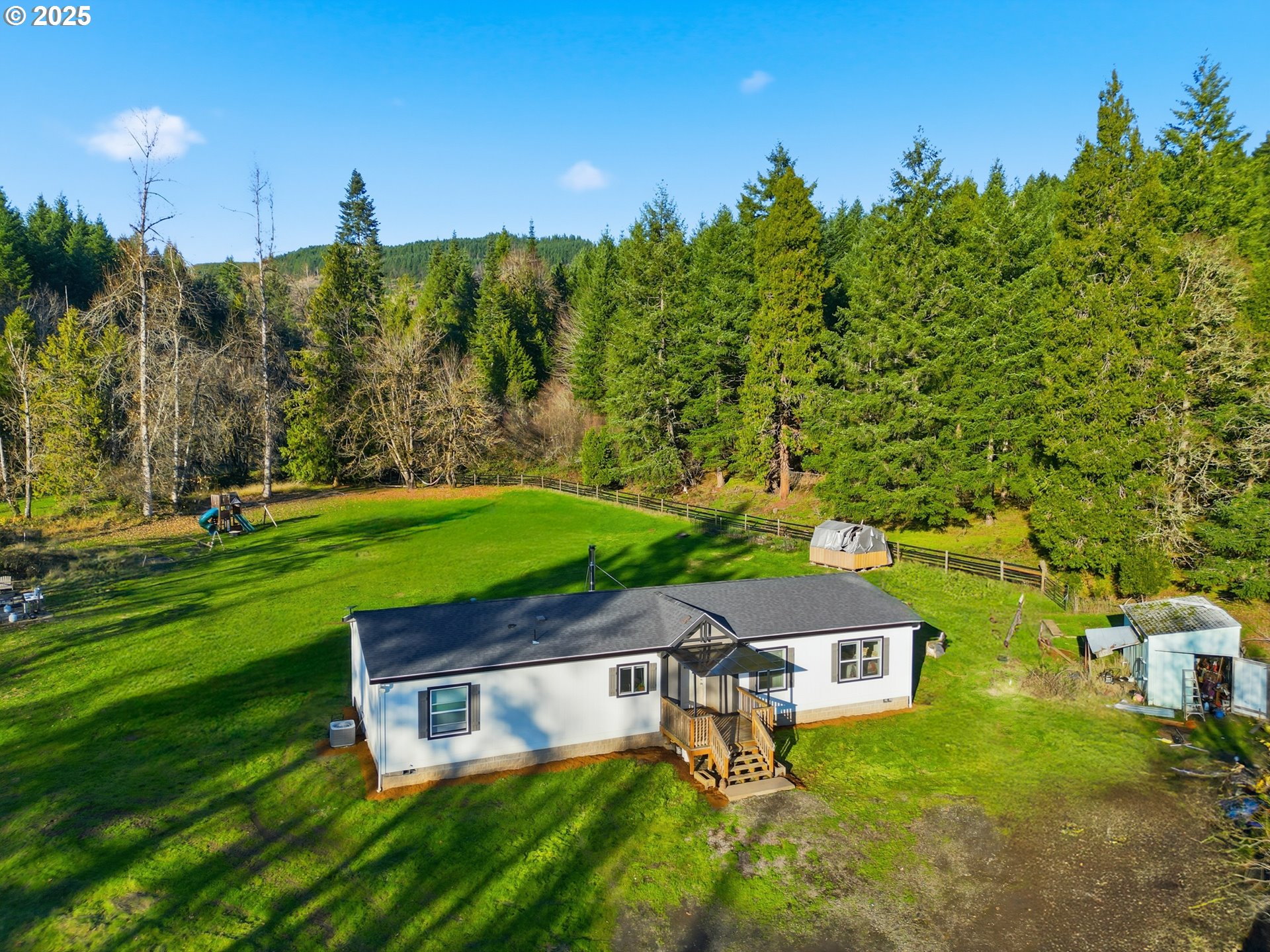 39557 Little Fall Creek Road Fall Creek, OR 97438 - Photo 3 of 43 a view of a swimming pool with a yard