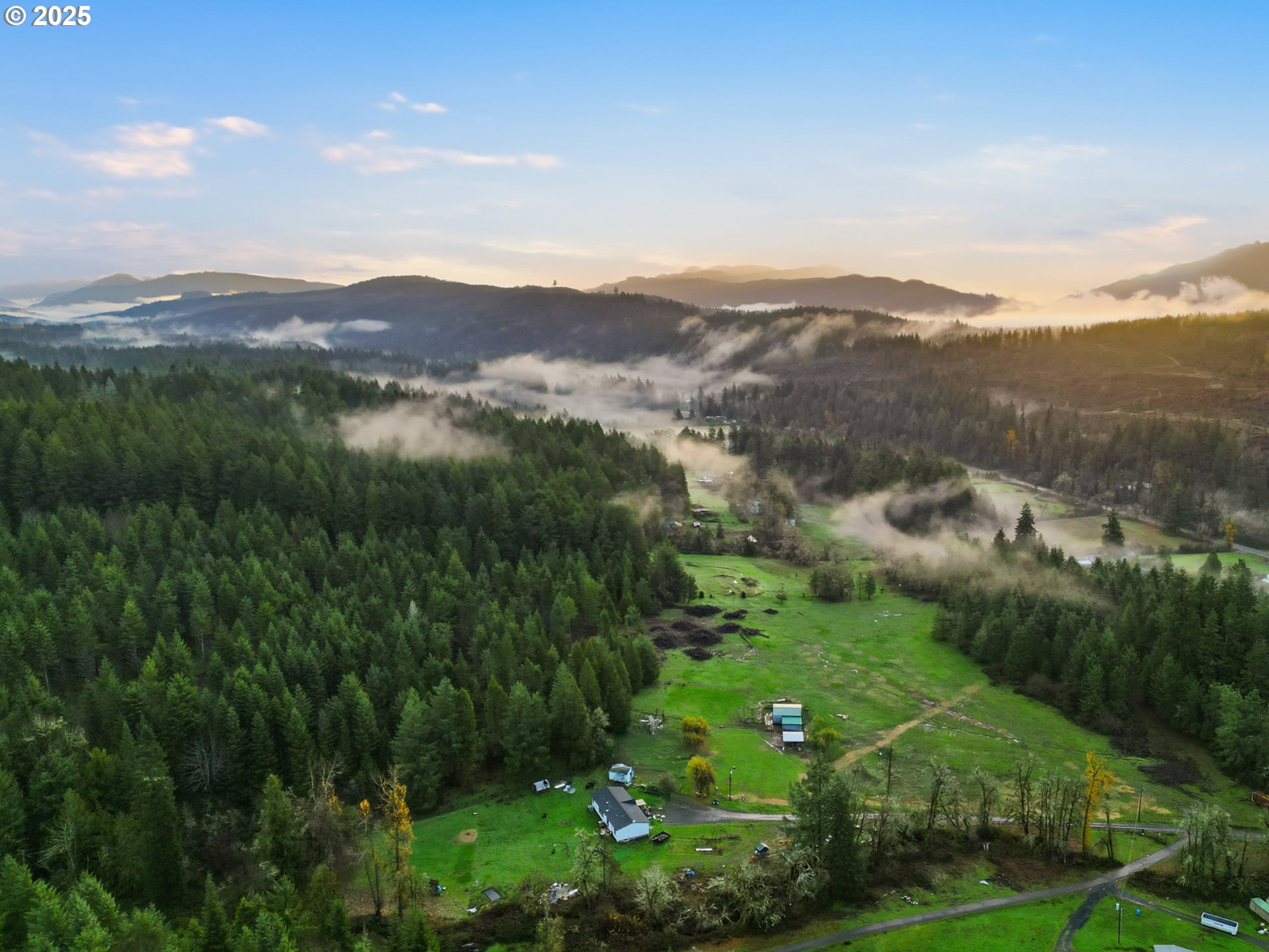 39557 Little Fall Creek Road Fall Creek, OR 97438 - Photo 4 of 43 a view of a lush green hillside and mountains
