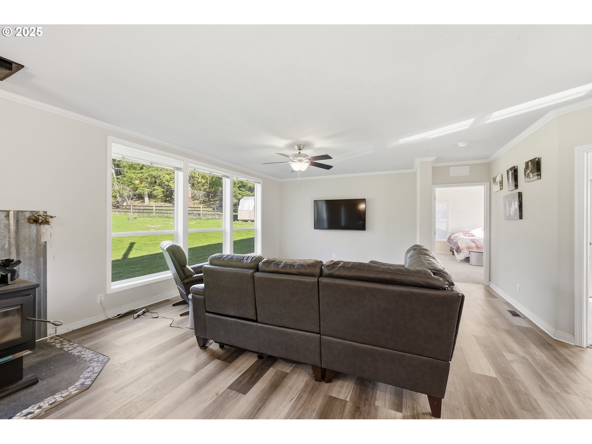 39557 Little Fall Creek Road Fall Creek, OR 97438 - Photo 5 of 43 a living room with furniture and a flat screen tv