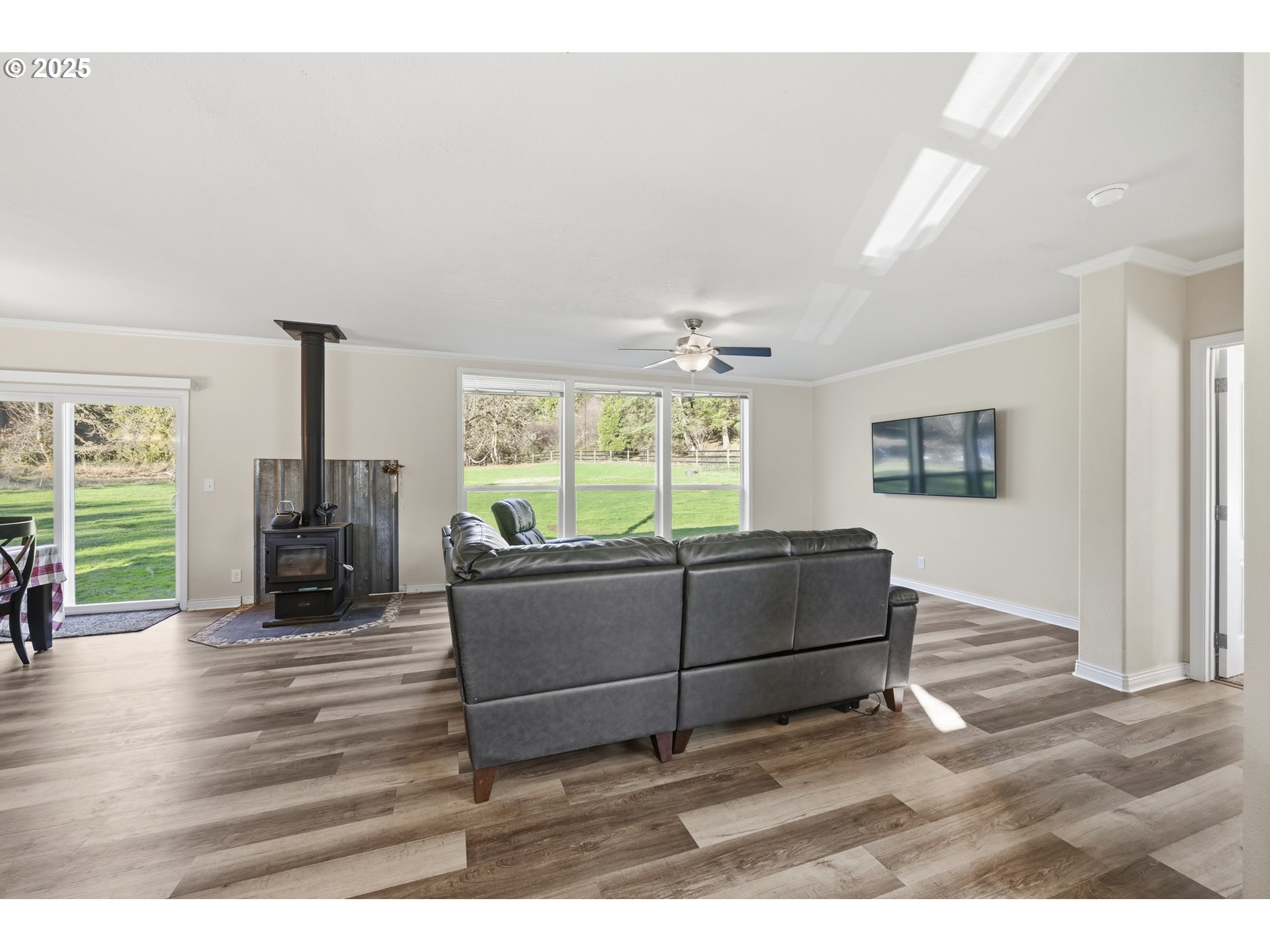 39557 Little Fall Creek Road Fall Creek, OR 97438 - Photo 6 of 43 a living room with furniture and a flat screen tv