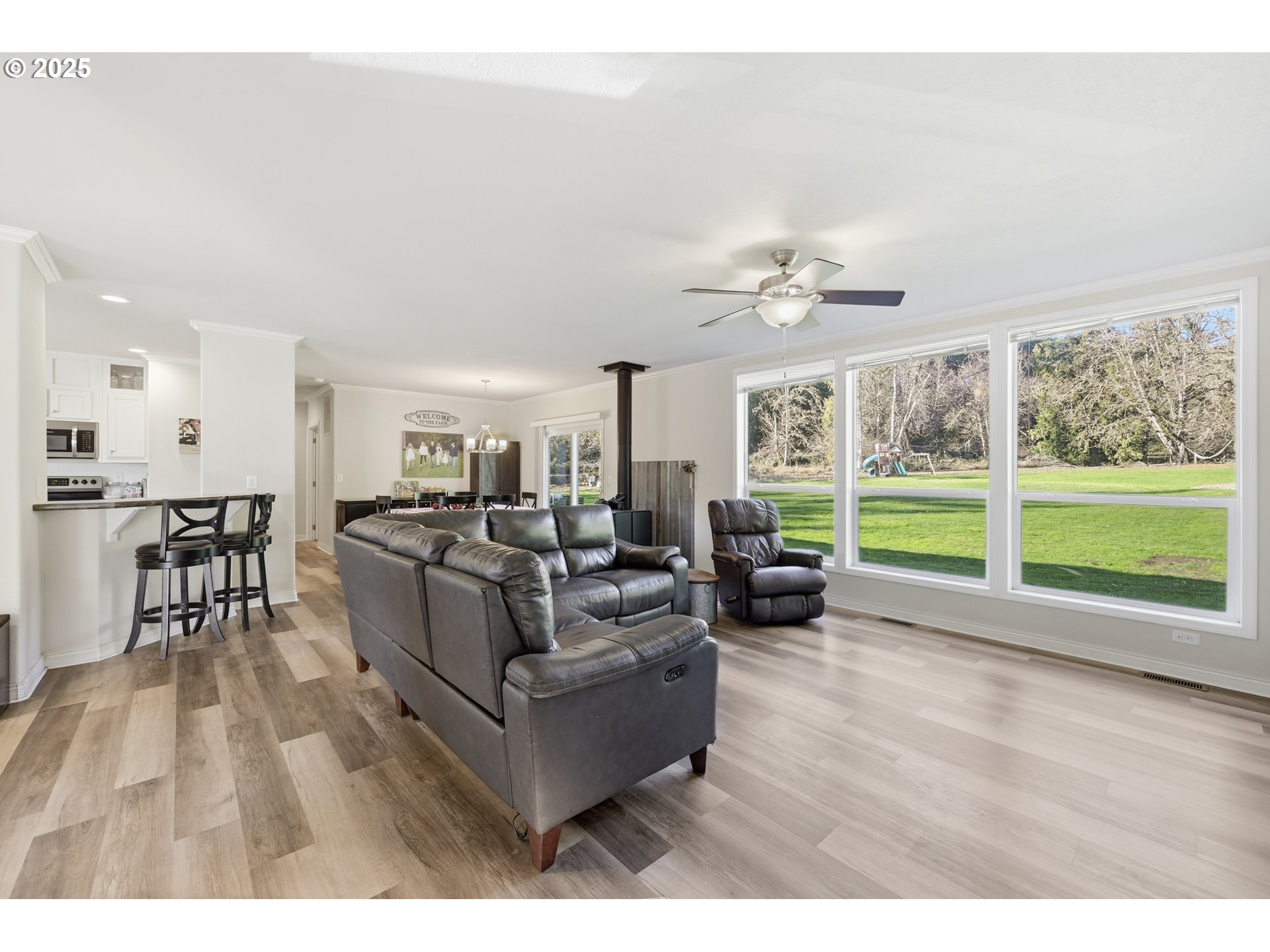39557 Little Fall Creek Road Fall Creek, OR 97438 - Photo 7 of 43 a living room with furniture and large windows