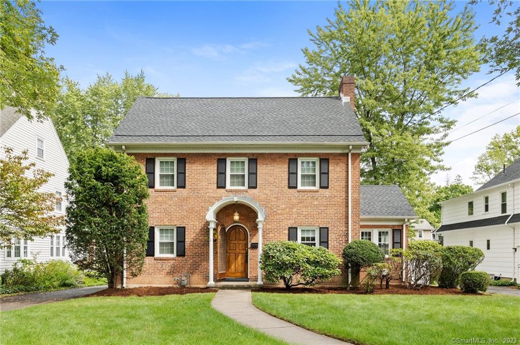Welcome home to this charming brick home with a brand new roof!