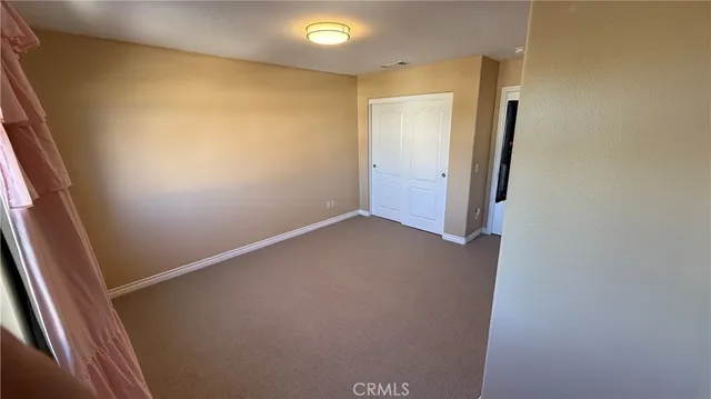a living room with furniture a fireplace and a potted plant