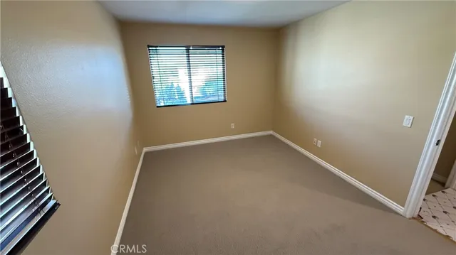 an empty room with closet area