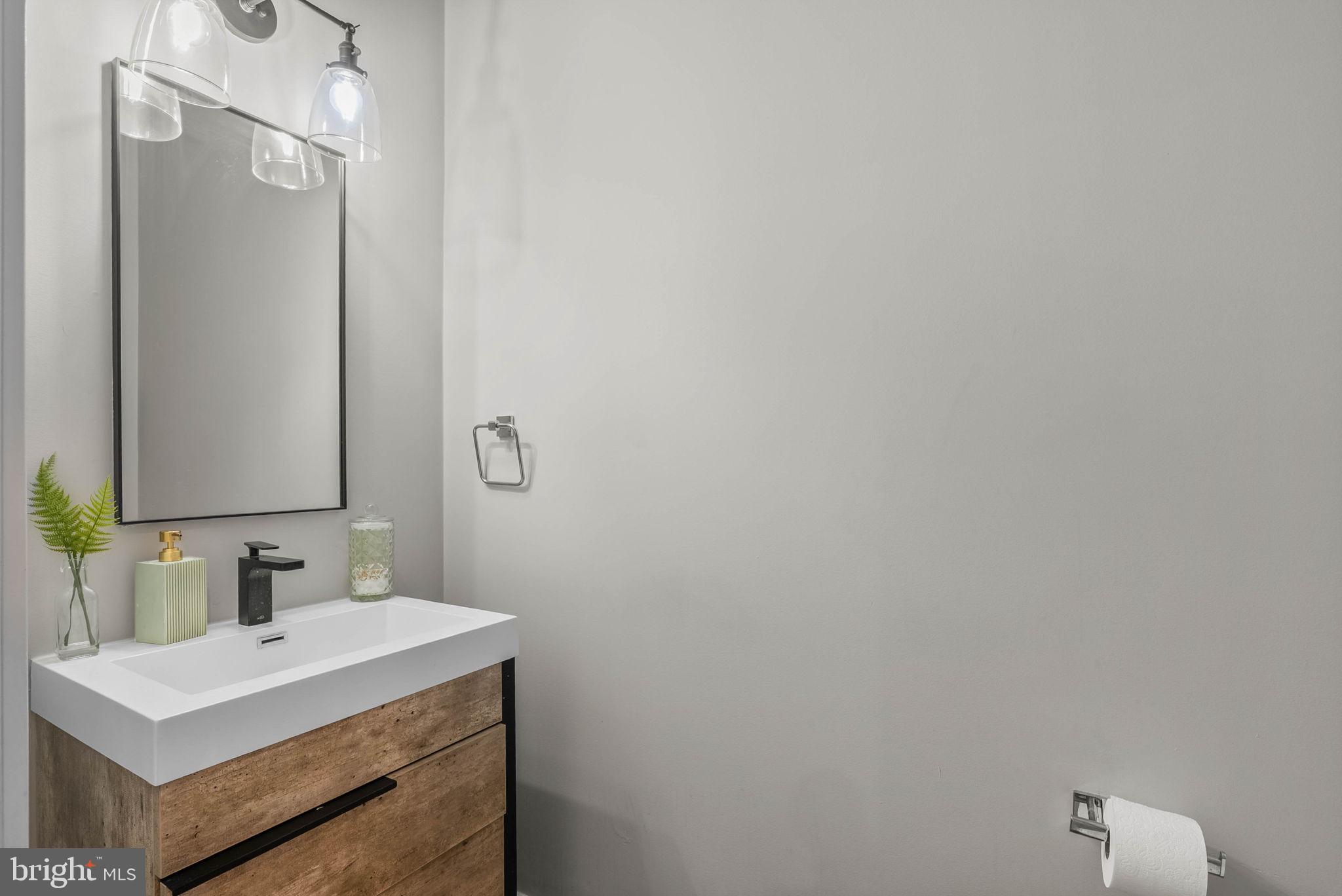 1517 North 27th Street Philadelphia, PA 19121 - Photo 11 of 31 a bathroom with a sink vanity and a mirror