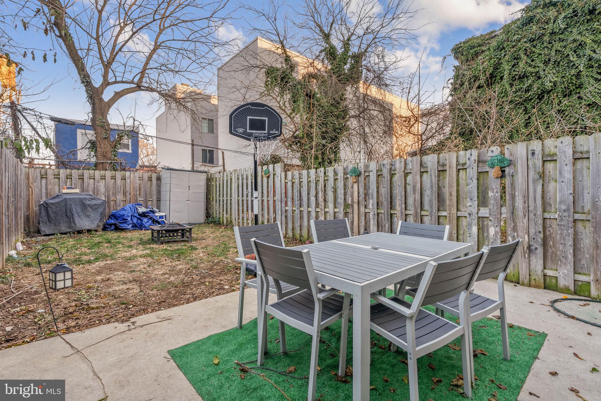 1517 North 27th Street Philadelphia, PA 19121 - Photo 12 of 31 a table and chairs in a backyard of the house