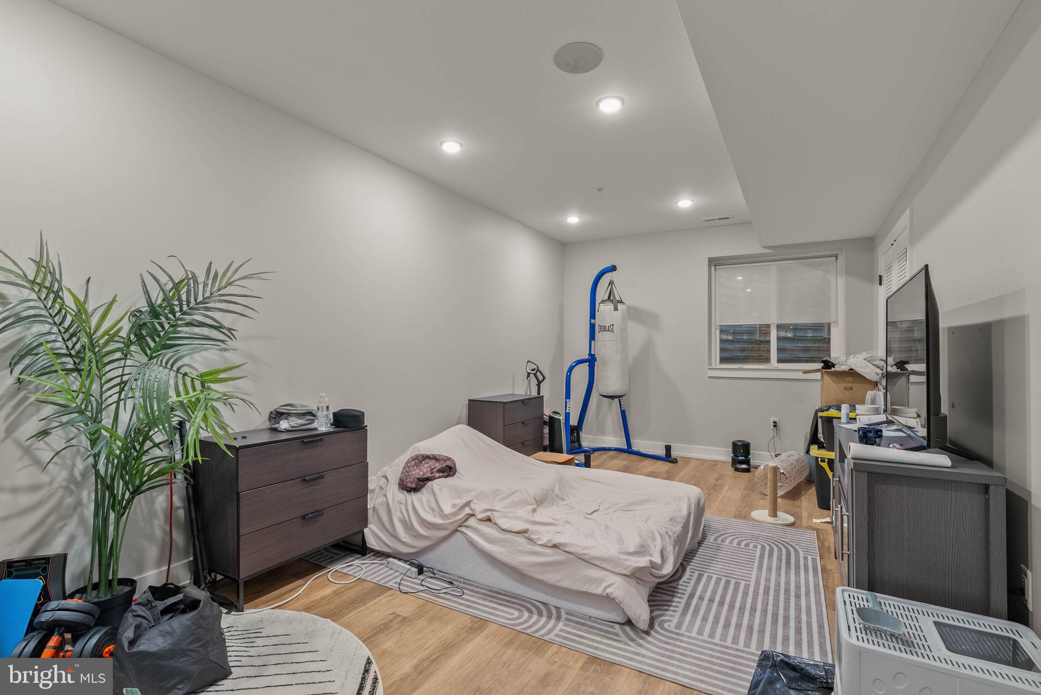 1517 North 27th Street Philadelphia, PA 19121 - Photo 16 of 31 a bed room with a bed window and a television