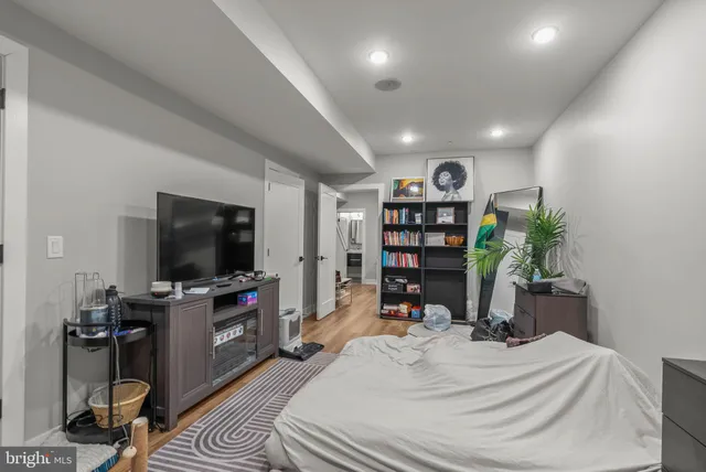 a view of hallway with wooden floor