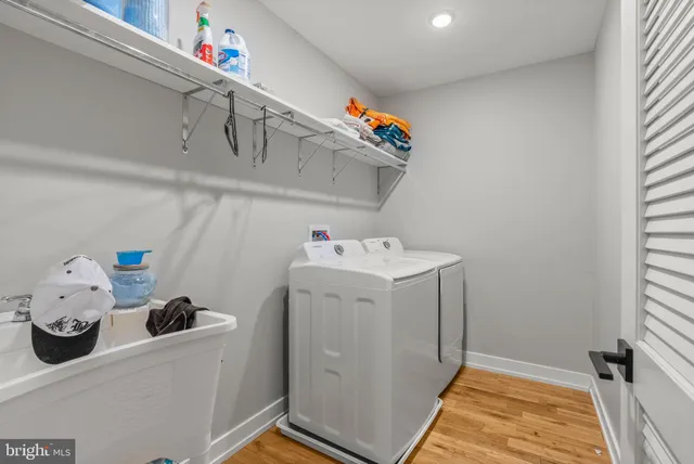 a bathroom with a sink toilet vanity and shower