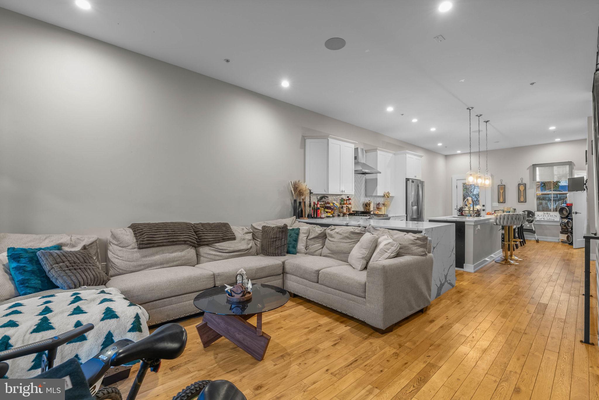 1517 North 27th Street Philadelphia, PA 19121 - Photo 2 of 31 a living room with furniture and kitchen view