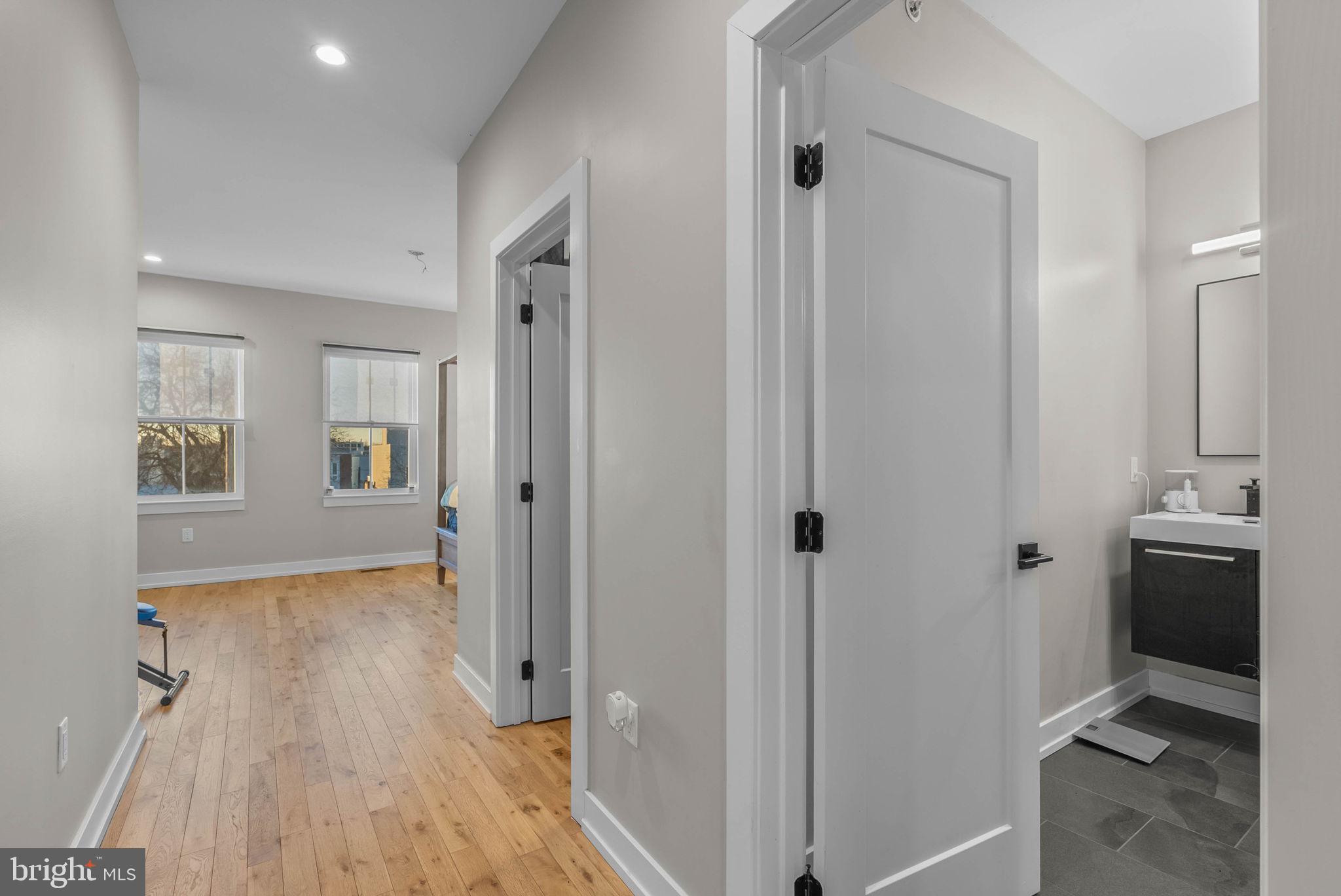 1517 North 27th Street Philadelphia, PA 19121 - Photo 25 of 31 a view of a hallway with wooden floor and a bathroom