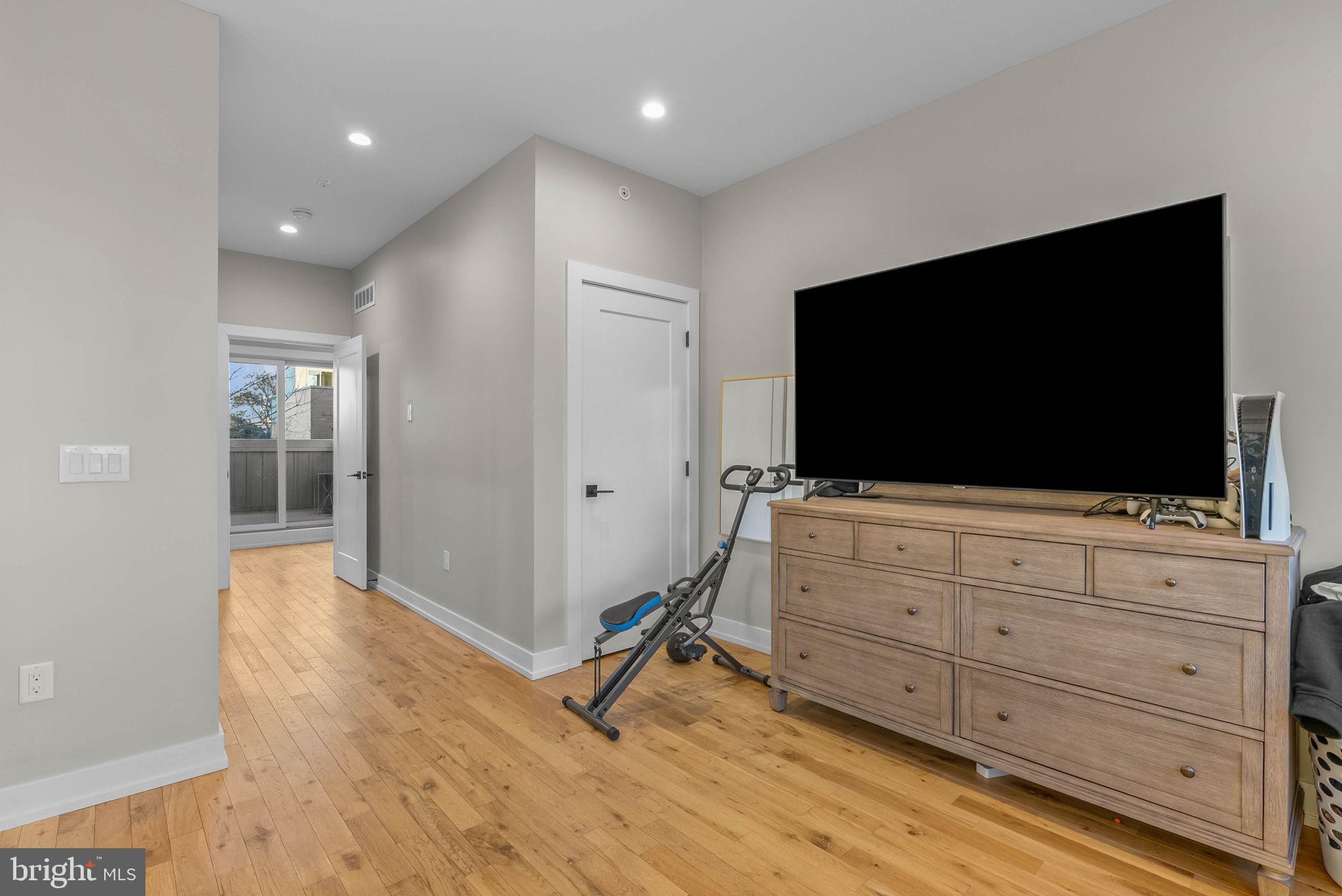 1517 North 27th Street Philadelphia, PA 19121 - Photo 29 of 31 a living room with furniture and a flat screen tv