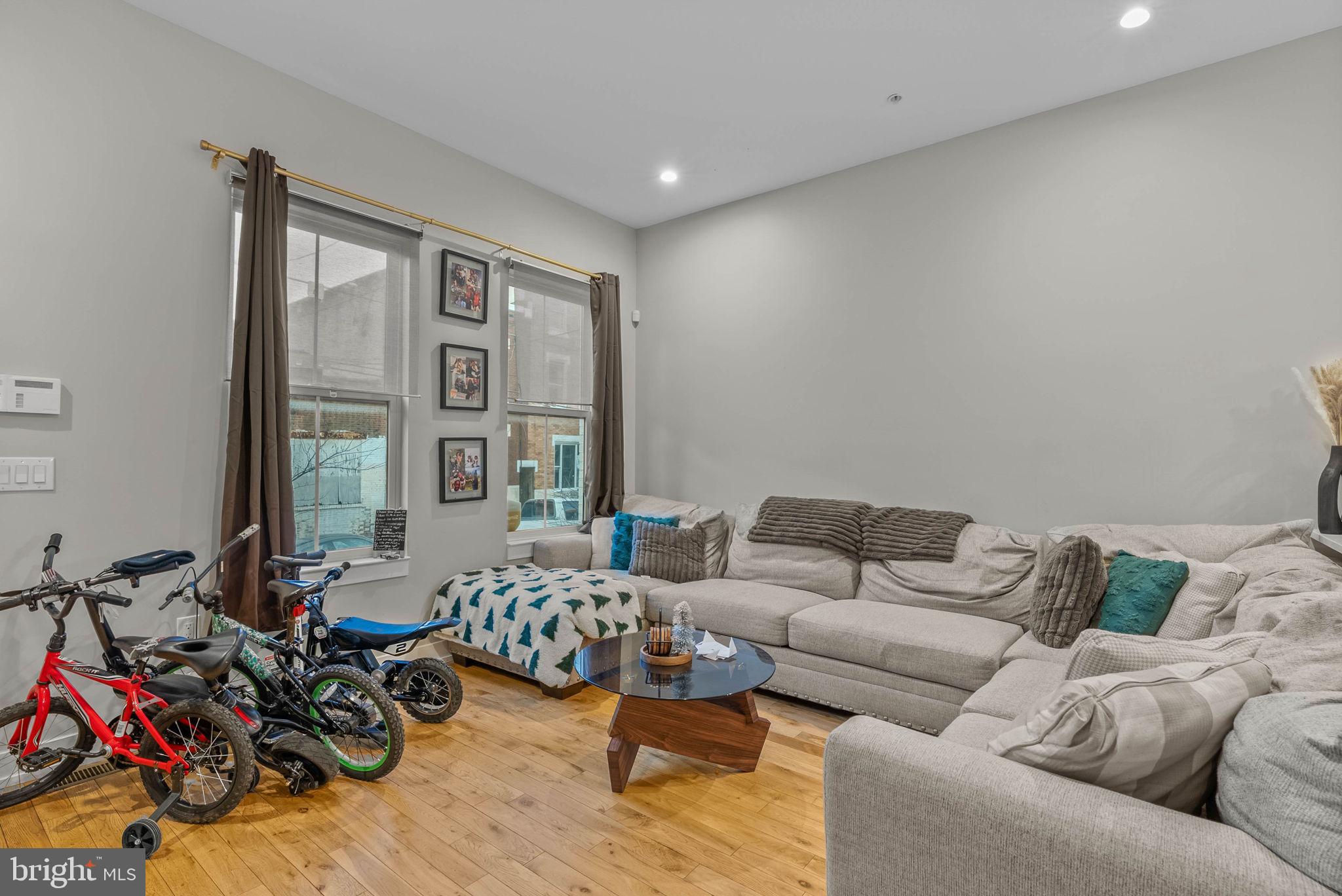 1517 North 27th Street Philadelphia, PA 19121 - Photo 3 of 31 a living room with furniture and a large window