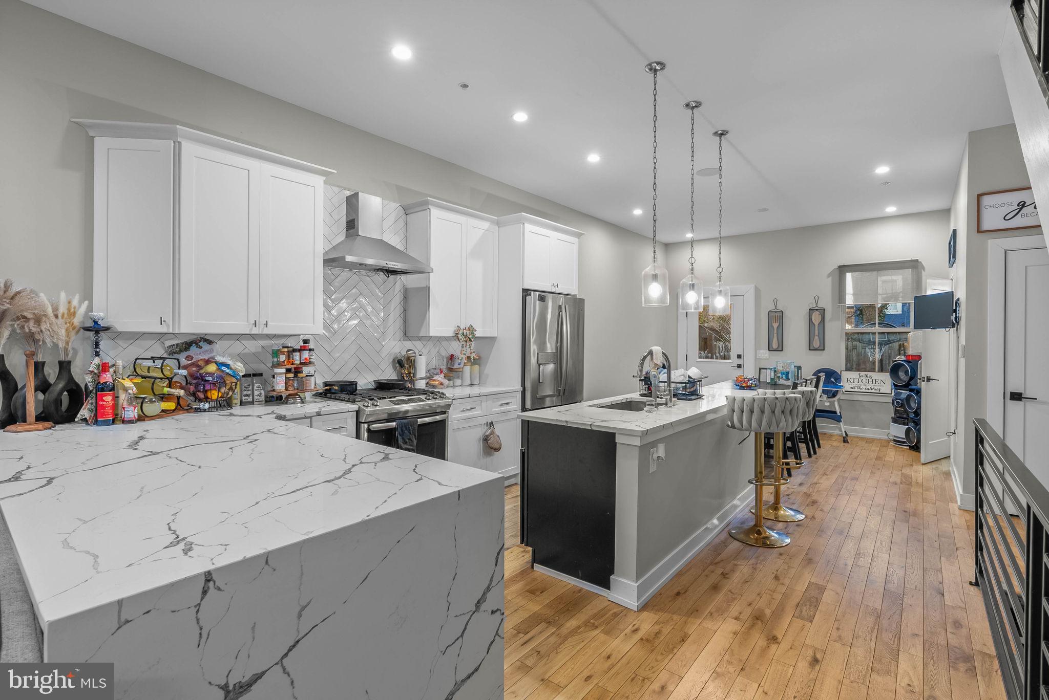 1517 North 27th Street Philadelphia, PA 19121 - Photo 5 of 31 a kitchen with a sink a counter top space stainless steel appliances and cabinets