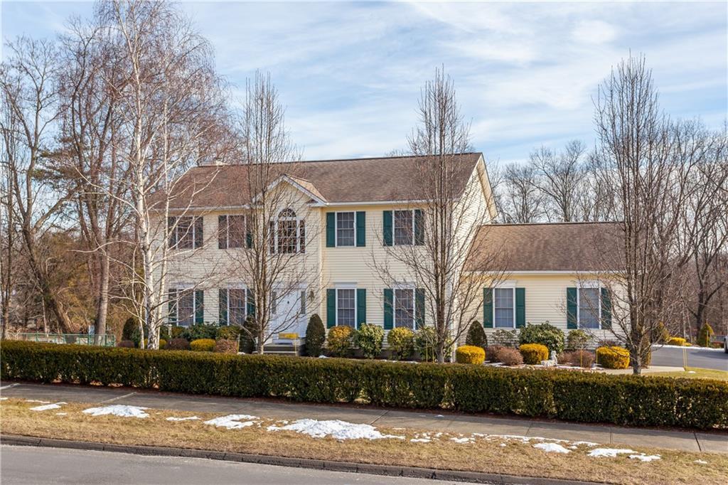 a front view of a house with a yard