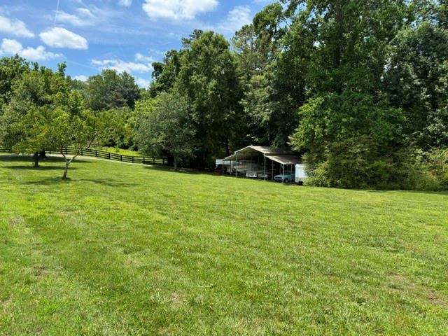 3535 Dr Bramblett Road Cumming, GA 30028 - Photo 83 of 91 a view of a green field with wooden fence
